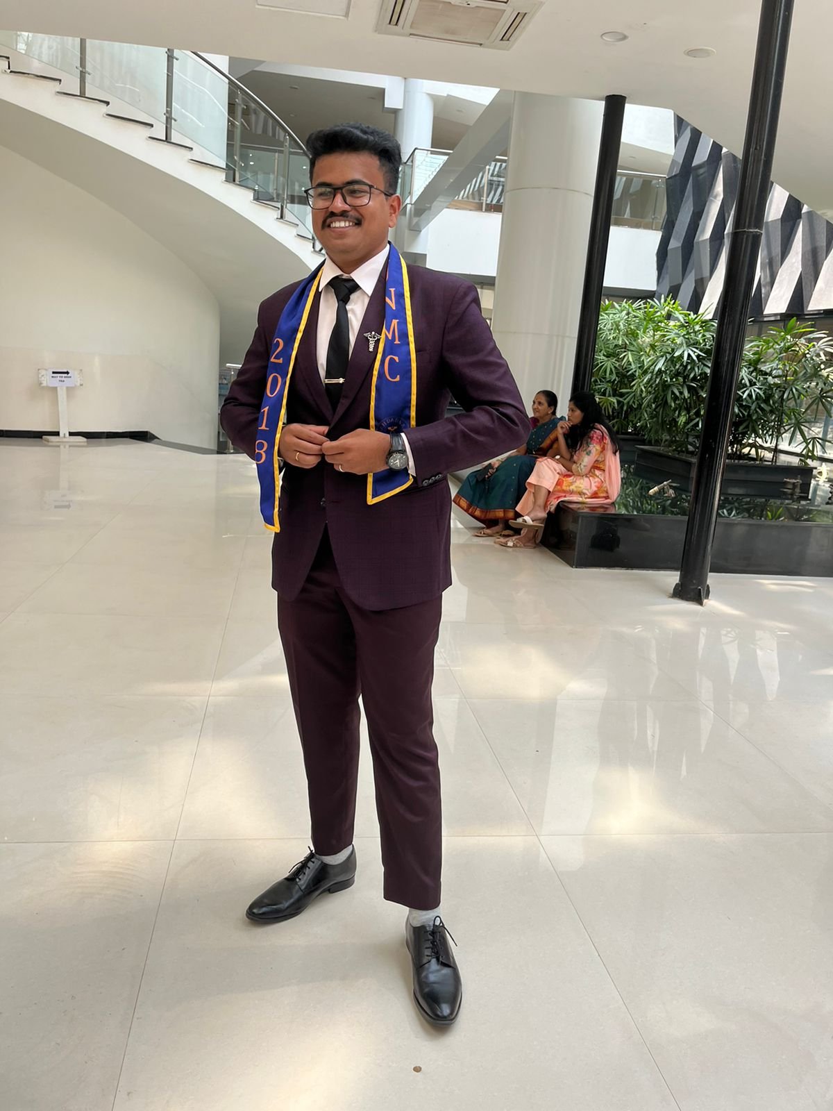 Sriram in a purple suit.